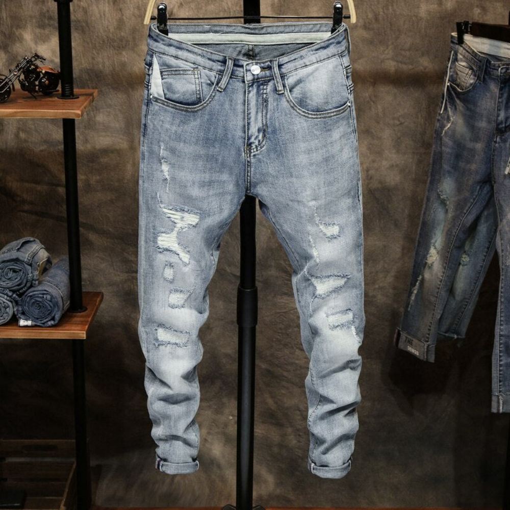 Jeansy Skinny Z Przetarciami W Jasnym Kolorze